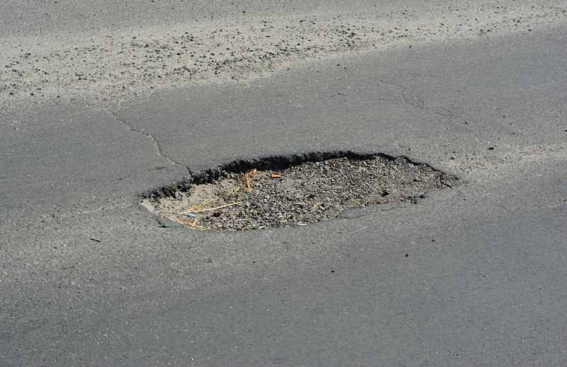 How Weather Conditions Affect Asphalt Cracks And Potholes